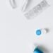 Contact lens, case and tweezers in a flatlay — representing CL services in UK independent optician practices