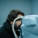 Patient receiving an OCT eye exam at a UK independent optician practice