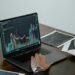 Laptop screen showing business analytics dashboard with charts and graphs — UK optician practice management software reporting comparison