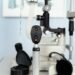 Direct ophthalmoscope and slit lamp in a UK independent optician practice — instruments central to the flashes and floaters acute pathway.
